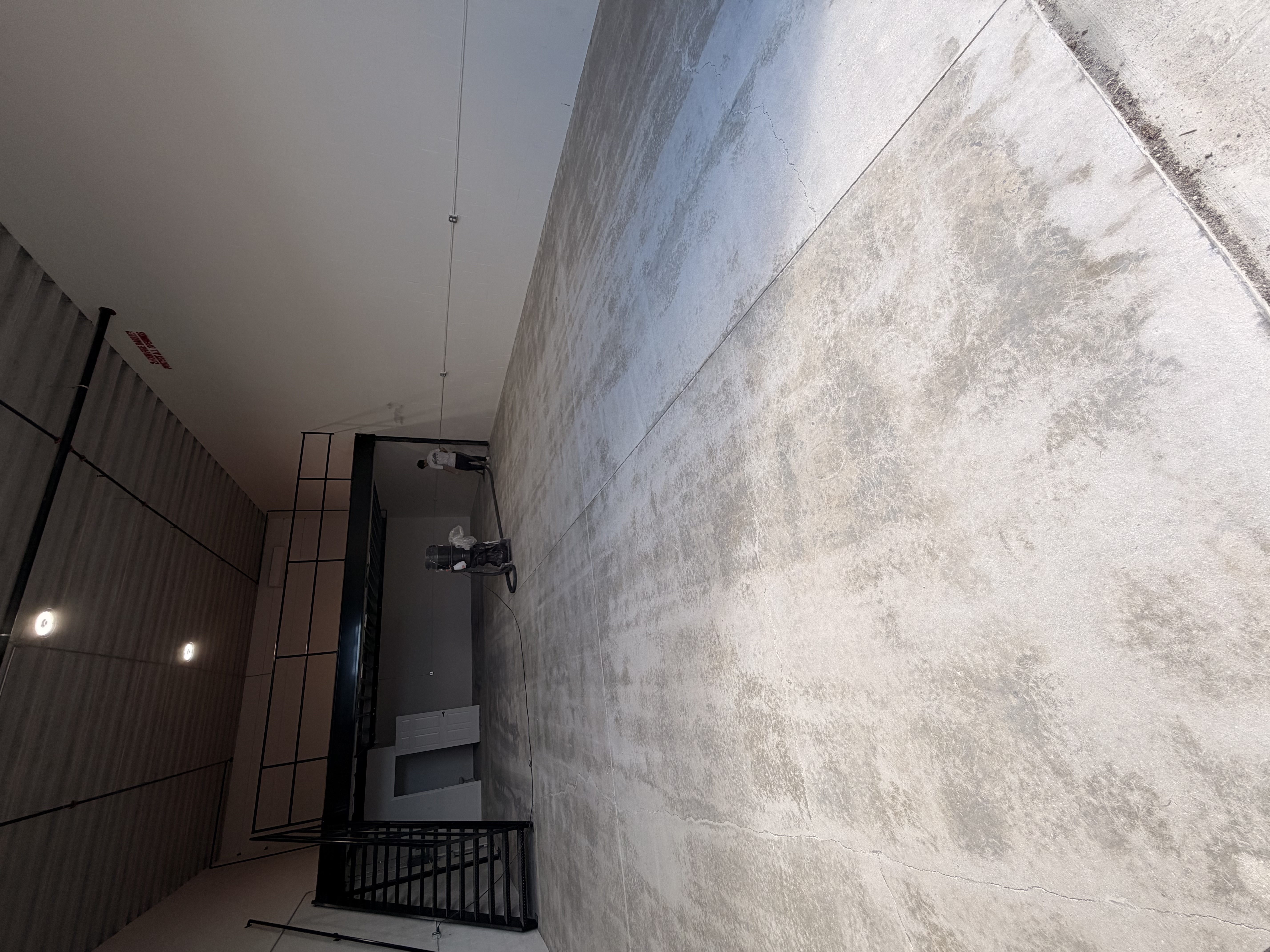 Bare concrete warehouse floor before epoxy in Kissimmee