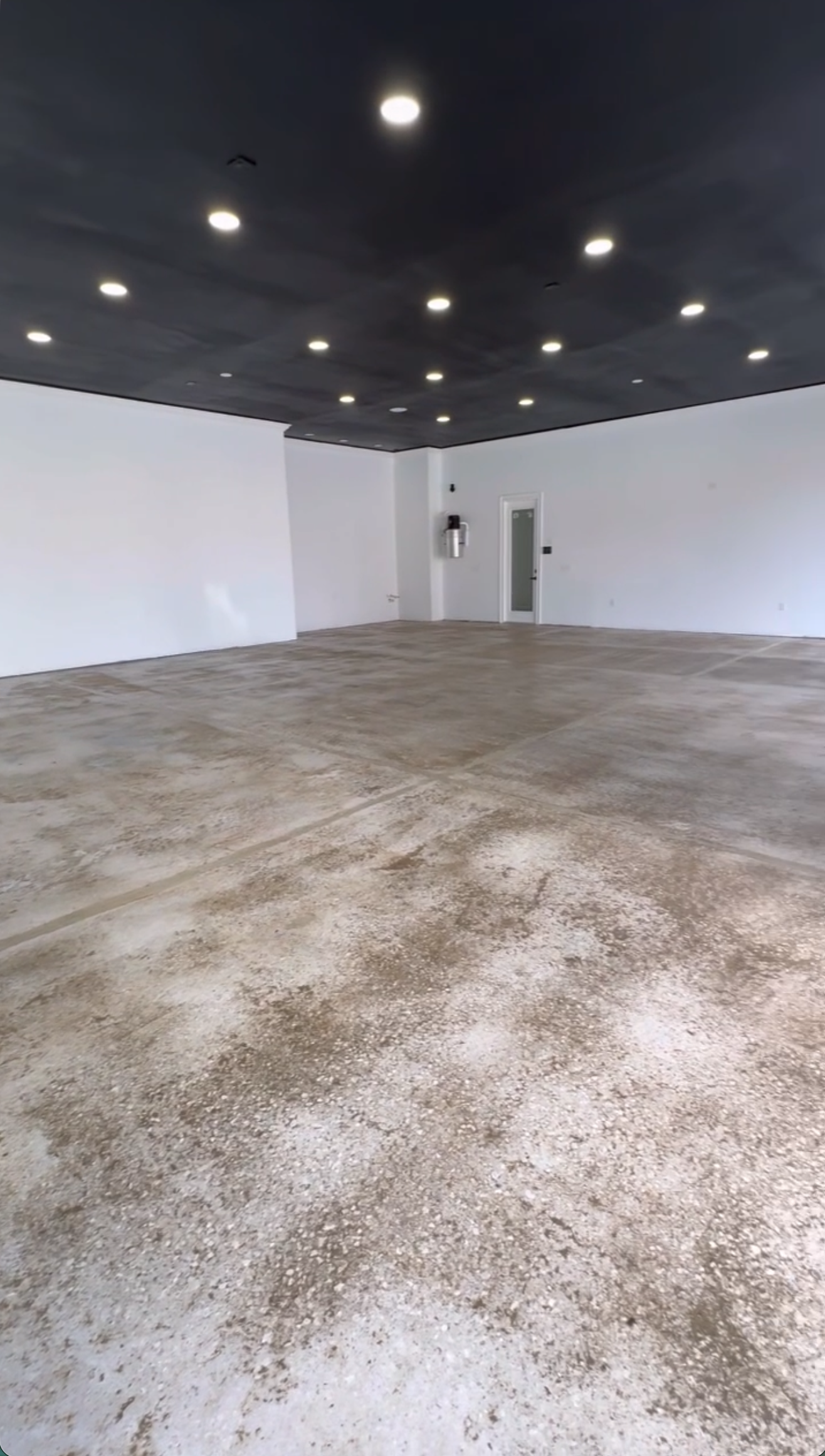 Bare concrete showroom floor before metallic epoxy in Lake Nona