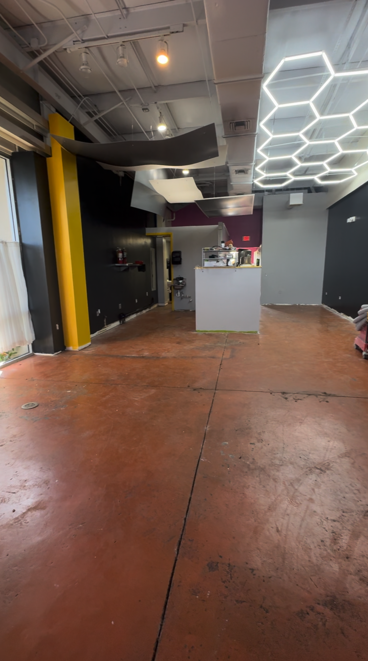 Worn commercial floor before epoxy coating in St. Cloud