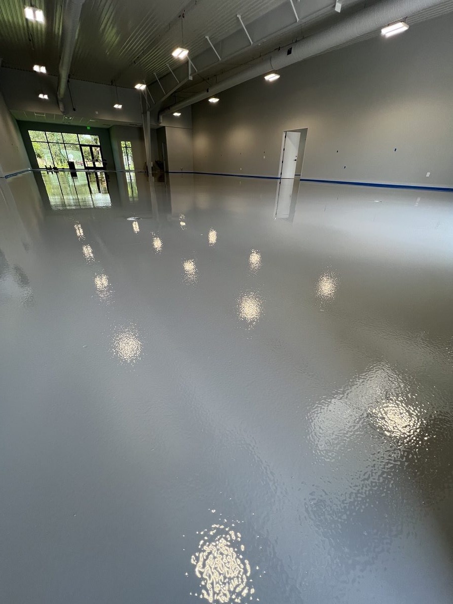 Gray epoxy floor coating in logistics warehouse